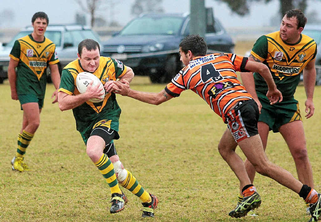 Wattles Reserve Grade player/coach Ross Hentschel takes on the Souths defence earlier this season. Wattles Reserve Grade player/coach Ross Hentschel takes on the Souths defence earlier this season.